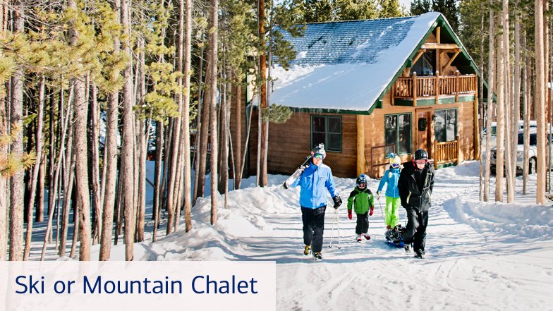 A family walking along a snowy path to go skiing. Their wooden house is close behind them, surrounded by trees. Text on the bottom left of this slide reads, “Ski or mountain chalet.”