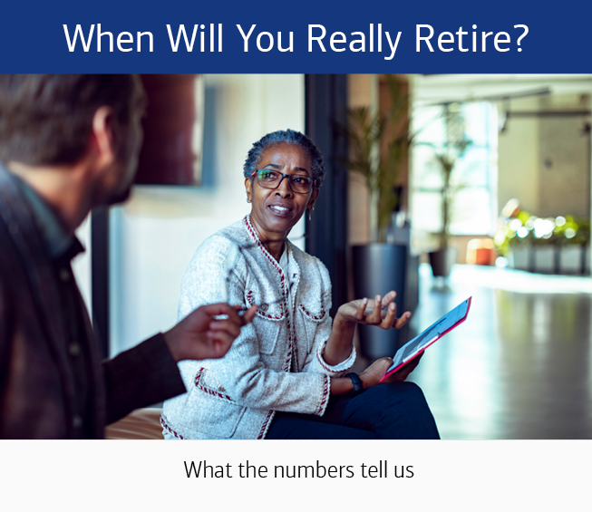 A woman sitting on a sofa, facing the camera, holding a notebook, speaking to a man who is facing away from the camera. The text at the top reads: When Will You Really Retire? The text at the bottom of reads: What the numbers tell us.