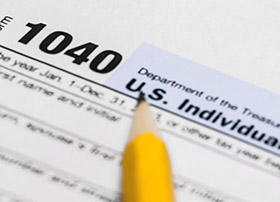 Article Image - Pencil on a 1040 tax form