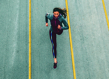 Article Image - A woman running on a track. Read tips from women leaders on how to plan for a comfortable retirement.