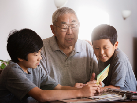 Grandfather with his grandkids reading